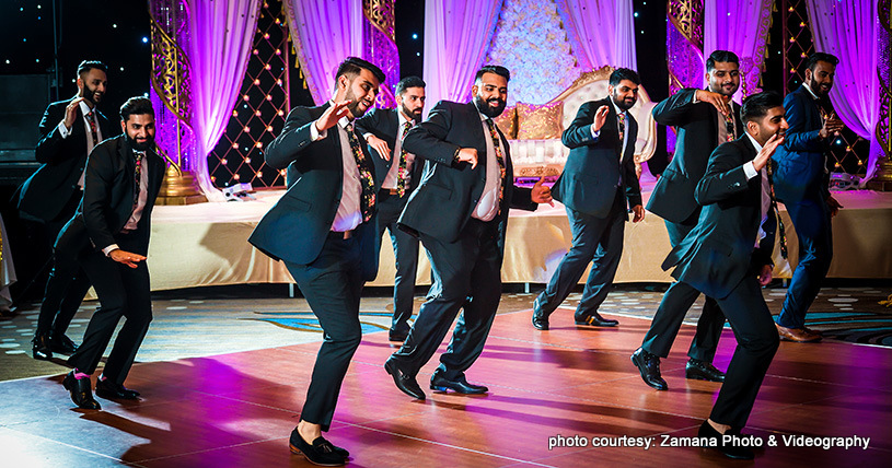 Indian groom with groomsmen dance